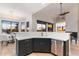 Modern kitchen featuring black cabinets, stainless steel appliances, and quartz countertops at 11617 E Raintree Dr, Scottsdale, AZ 85255