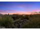 Expansive view of desert landscape with colorful sunset, showcasing Arizona beauty at 11617 E Raintree Dr, Scottsdale, AZ 85255