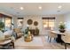 Bright living room with stylish furniture, area rug, and a view from the windows at 11617 E Raintree Dr, Scottsdale, AZ 85255