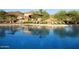Resort-style community pool with ample seating and shaded areas for relaxation at 11617 E Raintree Dr, Scottsdale, AZ 85255