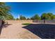 Large backyard featuring gravel, brick pavers, artificial turf, and block wall fencing at 1170 E Taylor Trl, San Tan Valley, AZ 85143