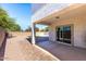 Covered patio and backyard featuring pavers and rock landscaping at 1170 E Taylor Trl, San Tan Valley, AZ 85143