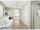 Bathroom featuring a soaking tub, vanity with sink, and a glass-enclosed shower at 1170 E Taylor Trl, San Tan Valley, AZ 85143