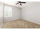 Bedroom with neutral paint, carpet, and white window shutters at 1170 E Taylor Trl, San Tan Valley, AZ 85143