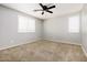 Bedroom with neutral paint, carpet, white window shutters, and ceiling fan at 1170 E Taylor Trl, San Tan Valley, AZ 85143