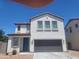 Inviting front exterior of a two-story home with a two-car garage at 1170 E Taylor Trl, San Tan Valley, AZ 85143