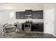 A kitchen featuring dark cabinets, stainless steel appliances, and granite countertops at 1170 E Taylor Trl, San Tan Valley, AZ 85143