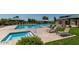 Sparkling community pool, spa, and lounge area with lush green grass at 1170 E Taylor Trl, San Tan Valley, AZ 85143