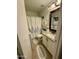 Well-maintained bathroom with a shower-tub combo, granite countertops, and tiled floors at 12008 W Acapulco Dr, El Mirage, AZ 85335