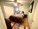 Cozy bedroom with ceiling fan, dark wood furnishings, and patterned area rug at 12008 W Acapulco Dr, El Mirage, AZ 85335