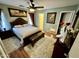 Comfortable bedroom features a ceiling fan, area rug, and coordinated decor at 12008 W Acapulco Dr, El Mirage, AZ 85335