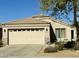 Charming home featuring a two-car garage, neutral-colored exterior, and well-manicured landscaping at 12008 W Acapulco Dr, El Mirage, AZ 85335