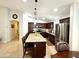 Eat-in kitchen showcasing stainless steel appliances and a large granite island with seating at 12008 W Acapulco Dr, El Mirage, AZ 85335