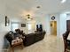 Bright living room featuring tiled floors, recessed lighting, and multiple seating areas at 12008 W Acapulco Dr, El Mirage, AZ 85335