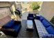 Relaxing patio with a grill, comfortable seating, and a peaceful place to enjoy the backyard at 12008 W Acapulco Dr, El Mirage, AZ 85335