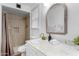 Bright bathroom boasts a modern vanity with a framed mirror and a tiled shower at 1226 E Fairmont Dr, Tempe, AZ 85282