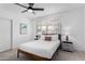 Cozy bedroom featuring a large window, neutral walls, and comfortable furnishings at 1226 E Fairmont Dr, Tempe, AZ 85282