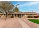 Charming single-story home featuring a brick facade and manicured desert landscaping and walkway at 1226 E Fairmont Dr, Tempe, AZ 85282