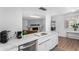 Well-lit kitchen boasts stainless steel appliances, a large island with white countertops at 1226 E Fairmont Dr, Tempe, AZ 85282