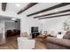 Bright living room featuring beamed ceilings, an open layout, and lots of natural light at 1226 E Fairmont Dr, Tempe, AZ 85282