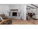 Bright living room features a painted brick fireplace, skylight, and open layout at 1226 E Fairmont Dr, Tempe, AZ 85282