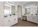 Elegant bathroom featuring dual vanities, quartz countertop, and a large, decorative mirror at 15993 W Poinsettia Dr, Surprise, AZ 85379
