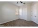 Empty bedroom featuring wood look flooring, a ceiling fan, and closet for storage at 15993 W Poinsettia Dr, Surprise, AZ 85379