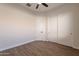 Bedroom featuring wood look flooring, a ceiling fan, and a closet for storage at 15993 W Poinsettia Dr, Surprise, AZ 85379
