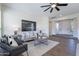 Inviting living room with modern decor, plush seating, and abundant natural light at 15993 W Poinsettia Dr, Surprise, AZ 85379