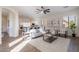 Bright living room showcasing an open-concept design with hardwood floors and modern decor at 15993 W Poinsettia Dr, Surprise, AZ 85379