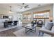 Spacious living room and dining area with large windows and modern decor at 15993 W Poinsettia Dr, Surprise, AZ 85379