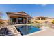 Backyard oasis with a sparkling pool, covered patio, outdoor seating and a built-in barbecue at 1633 N Woodruff --, Mesa, AZ 85207