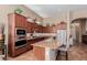 A well-equipped kitchen featuring stainless steel appliances, granite countertops, and ample cabinet space at 1633 N Woodruff --, Mesa, AZ 85207