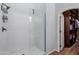 A modern shower with a glass enclosure and a view of the walk-in closet at 1633 N Woodruff --, Mesa, AZ 85207