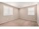 Empty bedroom with neutral carpet, windows, and recessed lighting at 17474 W Straight Arrow Ln, Surprise, AZ 85387