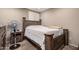 Bedroom with a bed, a fan and a nightstand with a drawer at 17474 W Straight Arrow Ln, Surprise, AZ 85387