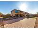 Exterior elevation of a two-story home showcasing its backyard living spaces at 17474 W Straight Arrow Ln, Surprise, AZ 85387