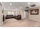Spacious living room with plush seating, recessed lighting, and neutral paint at 17474 W Straight Arrow Ln, Surprise, AZ 85387