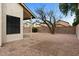 Private backyard featuring gravel landscaping, block wall fencing, and a covered patio area at 1811 S 39Th St # 30, Mesa, AZ 85206