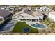Aerial view of the home showcasing a sports court, pool, putting green, and covered patio, perfect for entertaining at 20061 E Cherrywood Ct, Queen Creek, AZ 85142
