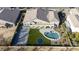 Overhead perspective of a home's outdoor space including a pool, sport court, and patio area at 20061 E Cherrywood Ct, Queen Creek, AZ 85142
