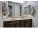 Bathroom features dual sinks, granite countertops, and dark cabinetry at 20061 E Cherrywood Ct, Queen Creek, AZ 85142
