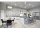 Spacious kitchen with stainless steel appliances, light wood floors, an island with bar stools, and a breakfast nook at 20061 E Cherrywood Ct, Queen Creek, AZ 85142