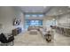 Spacious open-concept living room with tile floors, a large sectional sofa, and lots of natural light at 20061 E Cherrywood Ct, Queen Creek, AZ 85142