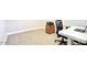 Office space featuring neutral carpet, a white desk, and a rolling chair at 20061 E Cherrywood Ct, Queen Creek, AZ 85142