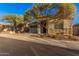 Charming home exterior featuring stone accents, desert landscaping and covered entryway at 21255 W Ashland Ave, Buckeye, AZ 85396