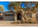 Charming home exterior featuring stone accents, desert landscaping and covered entryway at 21255 W Ashland Ave, Buckeye, AZ 85396