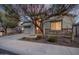 Charming home exterior featuring stone accents, desert landscaping and covered entryway at 21255 W Ashland Ave, Buckeye, AZ 85396