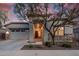 Charming home exterior featuring stone accents, desert landscaping and covered entryway at 21255 W Ashland Ave, Buckeye, AZ 85396