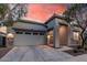 Charming home exterior featuring stone accents, desert landscaping and covered entryway at 21255 W Ashland Ave, Buckeye, AZ 85396